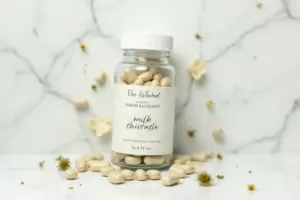 A premium bottle of milk thistle supplement with organic flowers for the 9 Best Milk Thistle Supplements for Liver Detox guide.