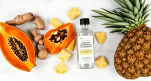 A premium editorial flat lay showing the 10 best plant-based digestive enzymes with fresh natural ingredients on a marble table.
