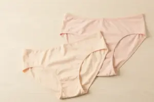 Seamless thongs for leggings displayed on a light neutral surface in an aesthetic fashion studio setting